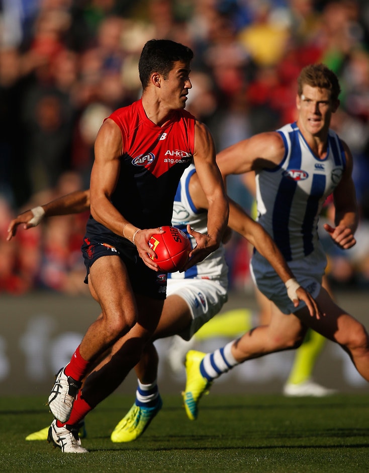 AFL 2016 Rd 03 - North Melbourne v Melbourne HOBART, AUSTRALIA - APRIL 10: Billy Stretch of the Demons attempts to move the ball forward during the 2016 AFL Round 03 match between the North Melbourne Kangaroos and the Melbourne Demons at Blundstone Arena, Hobart on April 10, 2016. (Photo by Sean Garnsworthy/AFL Media)